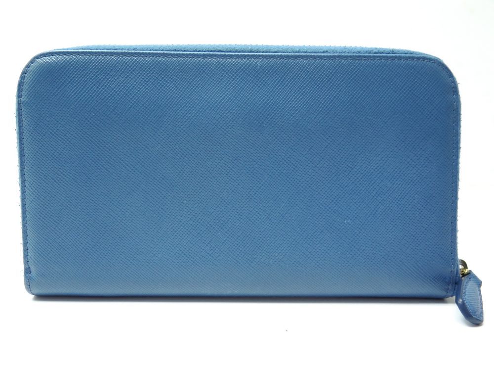 portefeuille prada long en cuir saffiano bleu porte