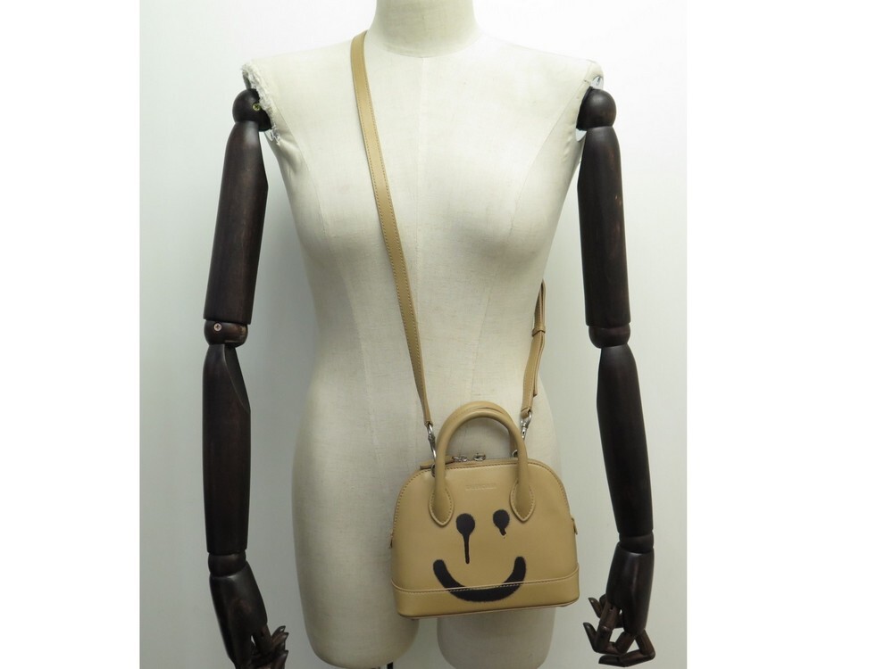 Balenciaga smiley hot sale face bag