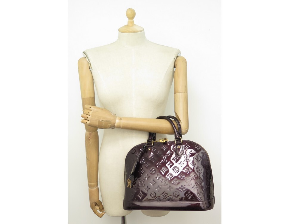 Vuitton Sac Alma cuir empreinte vernis prune