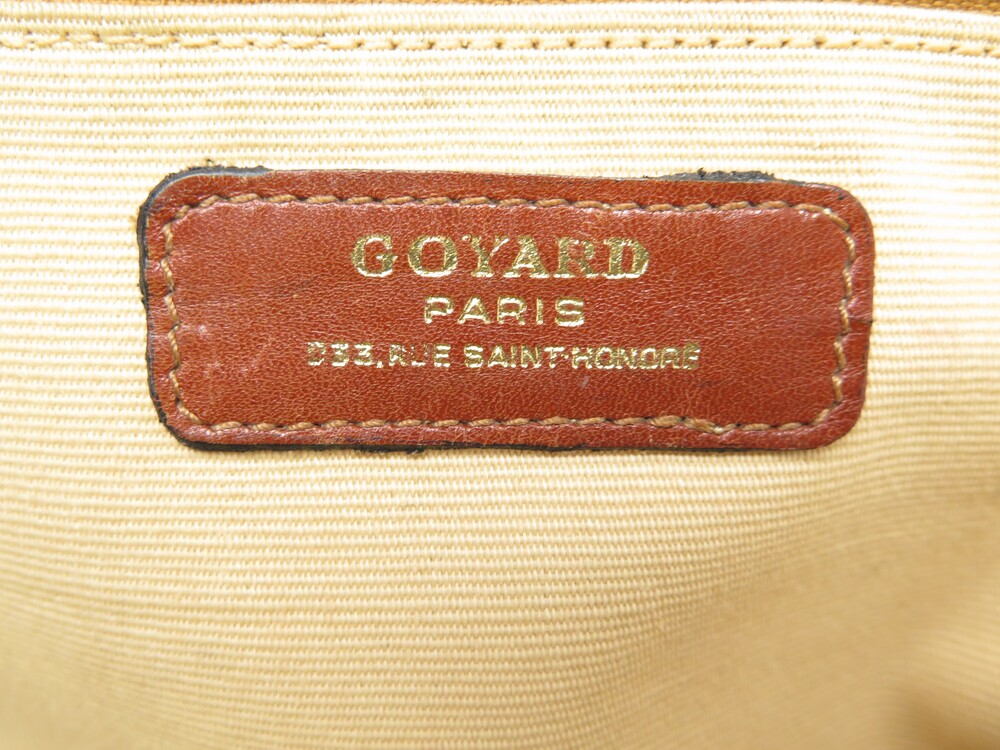 GOYARD Sac de voyage en cuir et toile monogrammée. On y…